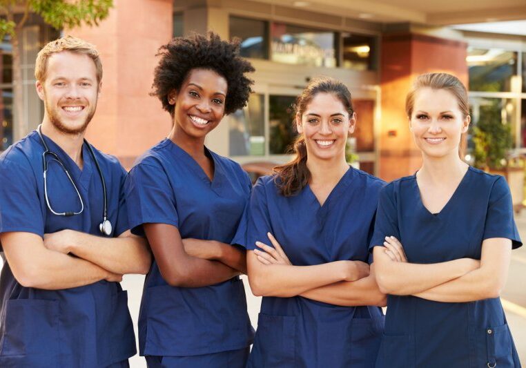 Portrait Of Medical Team Standing Outside Hospital